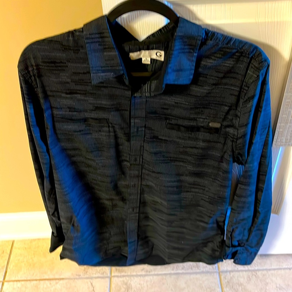 Long sleeve button up, black dress shirt by Guess. Very stylish.